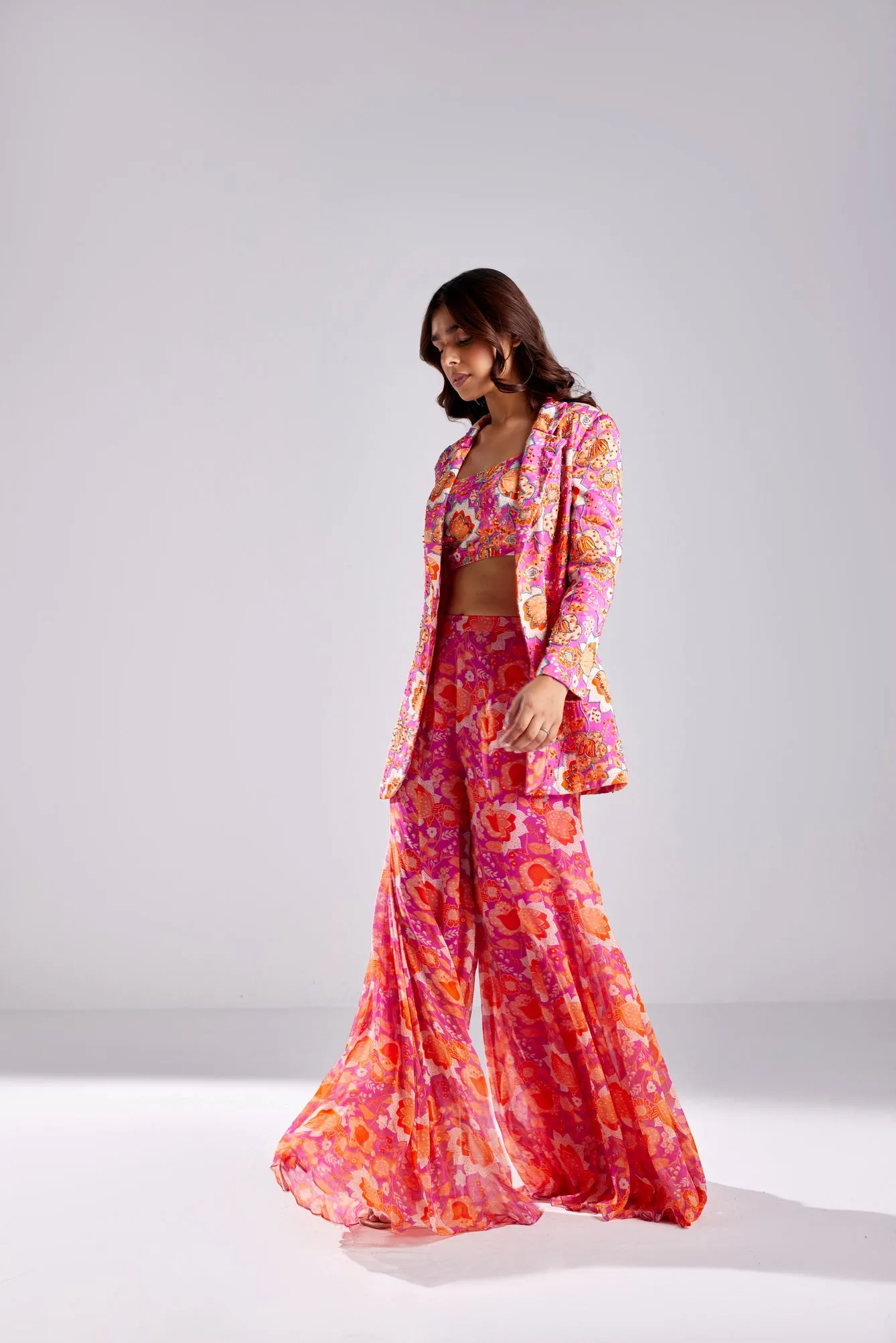 FUSCHIA PINK BLAZER WITH BUSTIER AND FUSCHIA FLORLA JAAL PRINTED BELL BOTTOM PANTS