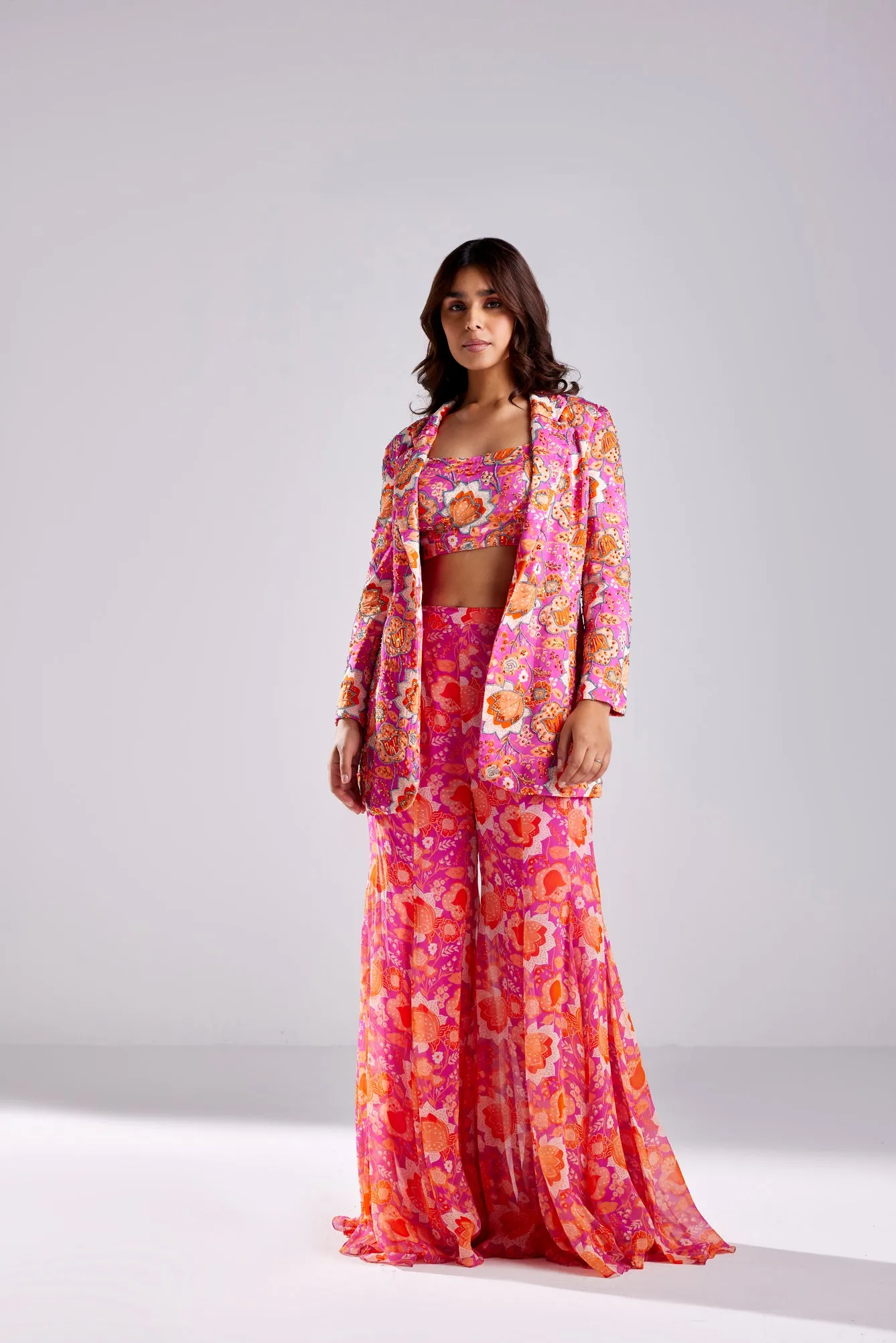 FUSCHIA PINK BLAZER WITH BUSTIER AND FUSCHIA FLORLA JAAL PRINTED BELL BOTTOM PANTS