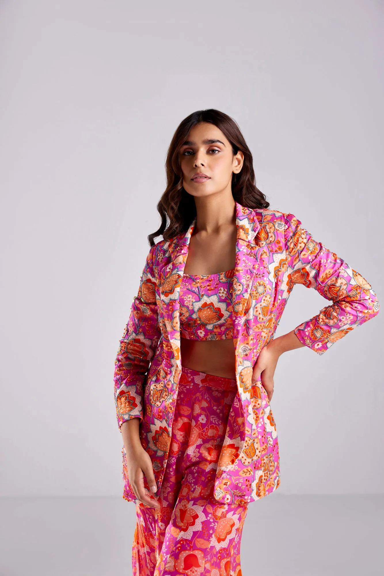 FUSCHIA PINK BLAZER WITH BUSTIER AND FUSCHIA FLORLA JAAL PRINTED BELL BOTTOM PANTS