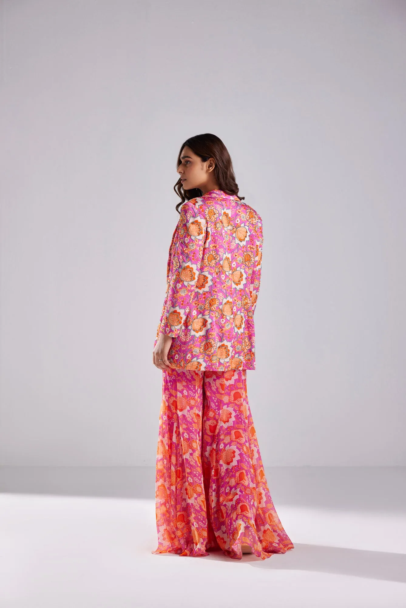 FUSCHIA PINK BLAZER WITH BUSTIER AND FUSCHIA FLORLA JAAL PRINTED BELL BOTTOM PANTS